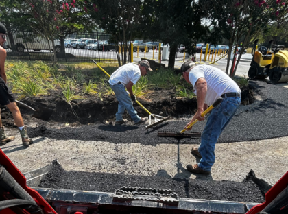 Pave Pro's crew spreading asphalt.